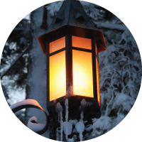 A photo of a bright, snowy lantern on MSU's campus during the winter. 
